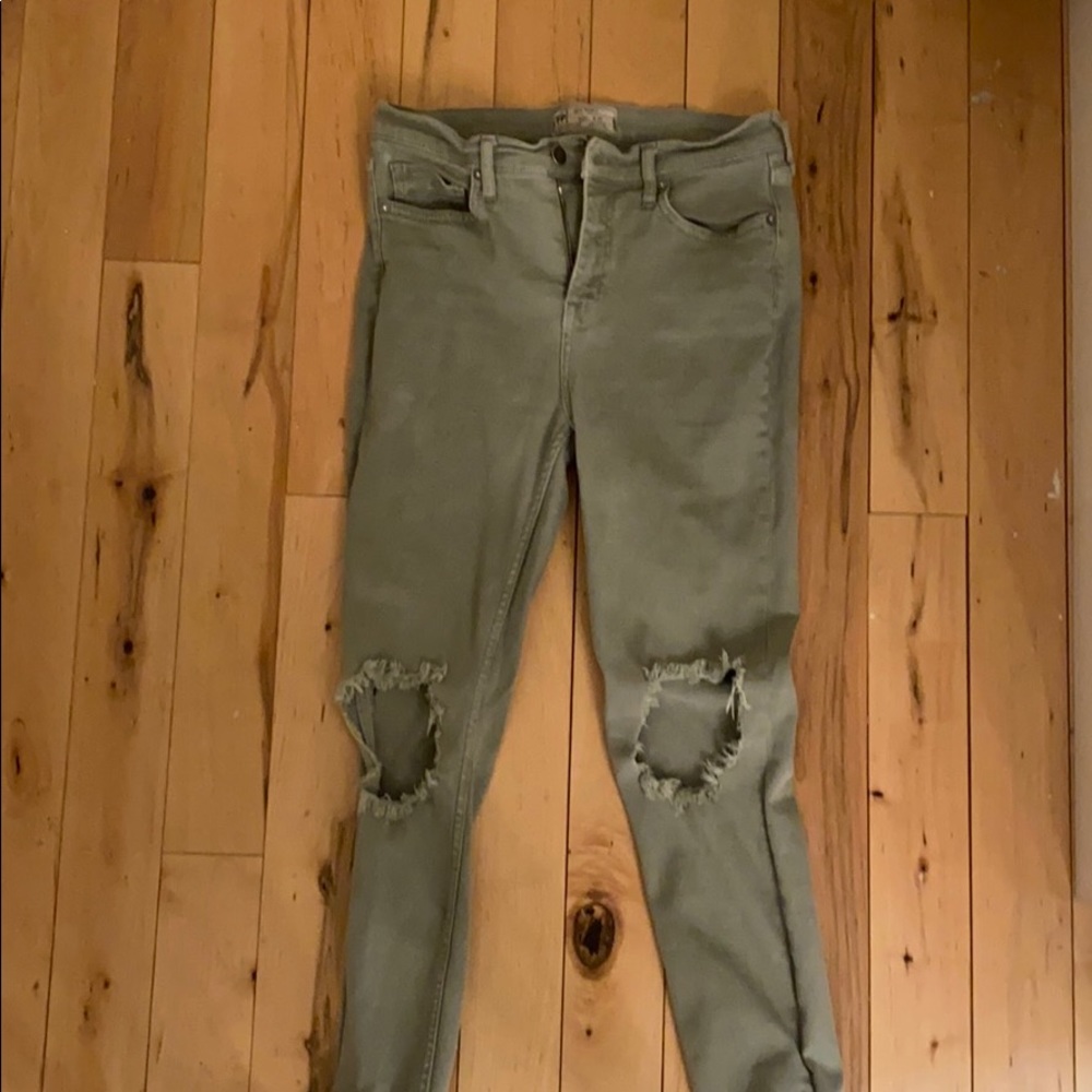 Free people green jeans with rips in the knees